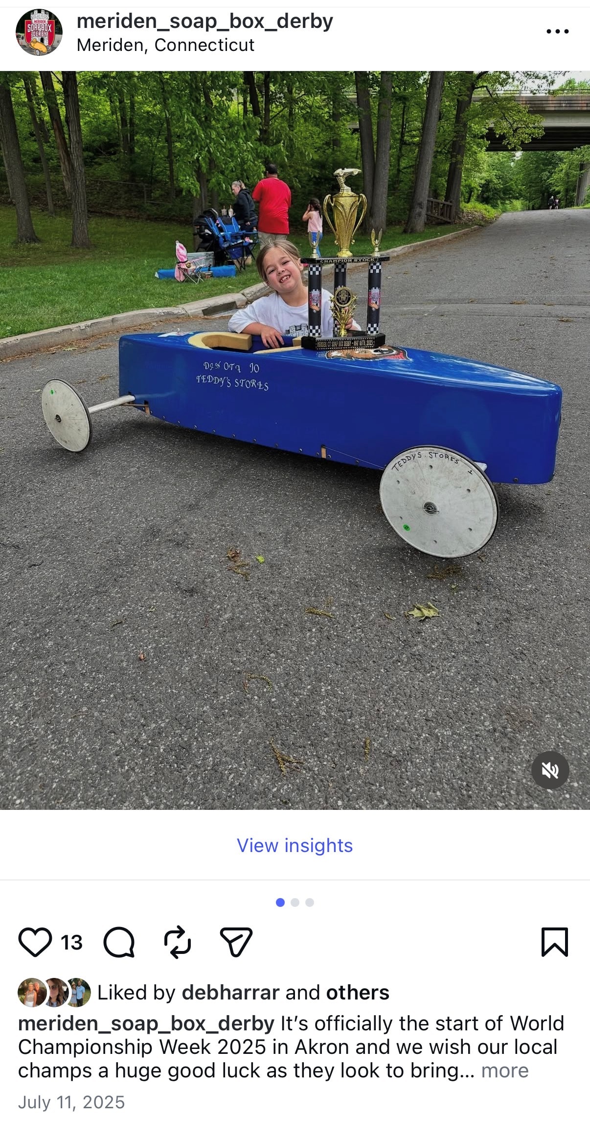 Meriden Soap Box Derby — child with soap box derby racing car trophy